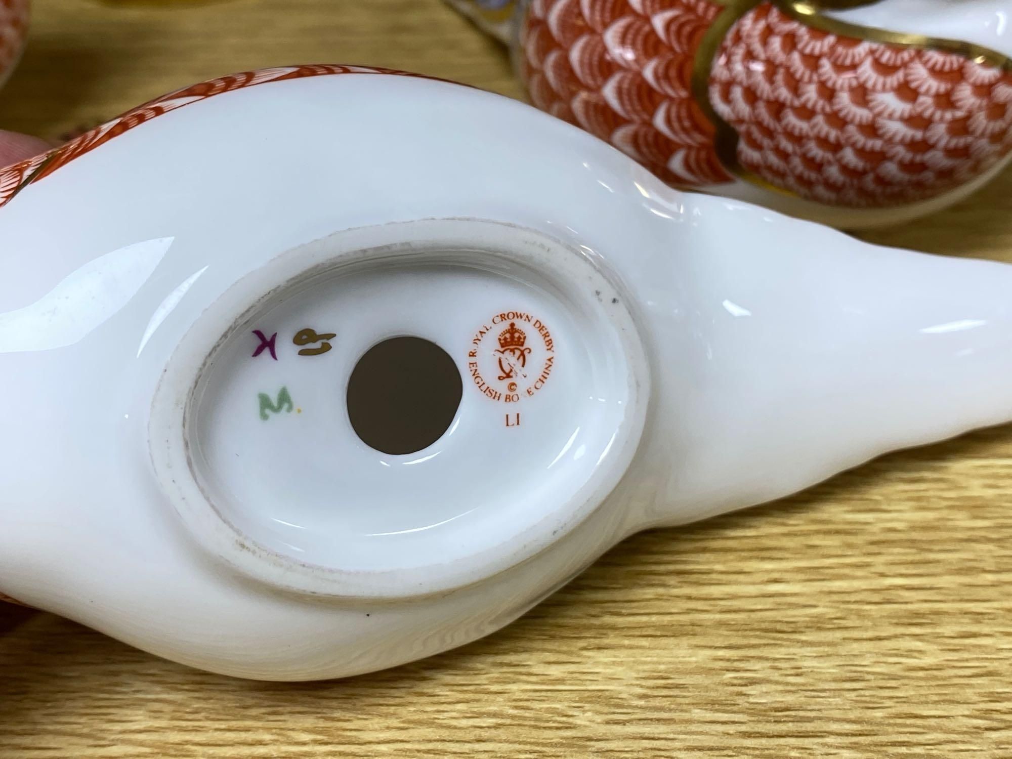 A graduated set of Beswick flying ducks and five Royal Crown Derby animal paperweights and another similar rabbit, fish 18cm